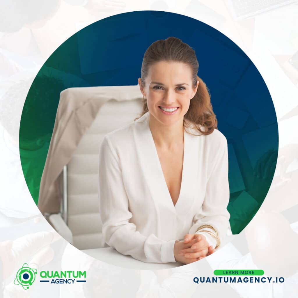 White-label SEO Quality Control: 14-Point Audit That Prevents Common Delivery Failures and Protects Agencies 2 Corporate branding graphic from Quantum Agency showing a smiling female executive in a white blouse sitting at a desk with her hands clasped. The central image is framed in a large circle with the Quantum Agency logo and a "Learn More quantumagency.io" call to action in the bottom corner.